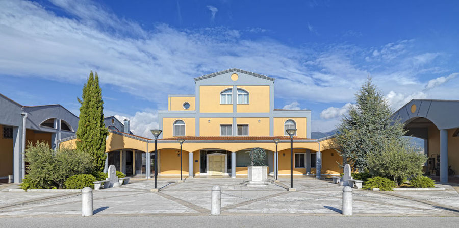 stone pavement in front of the building entrance with columns at Domaine Costa Lazaridi Drama